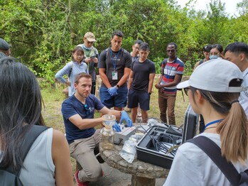 Participants actively engaged in a hands-on learning experience on eDNA sampling methods during the workshop, gaining practical knowledge in sampling and processing eDNA samples in the field.